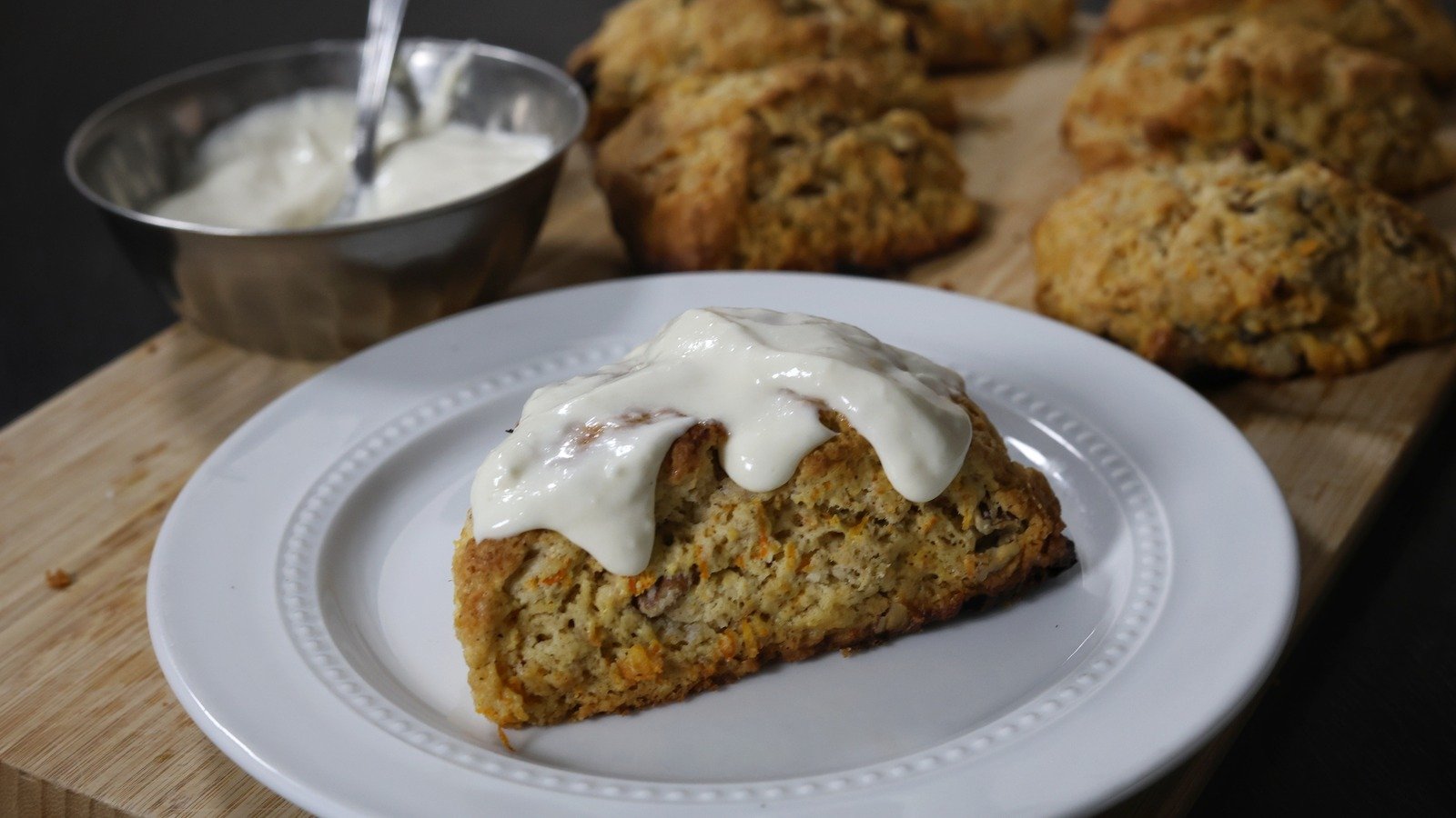 Indulge in Delectable Carrot Cake Scones Topped with Irresistible Cream Cheese Glaze!